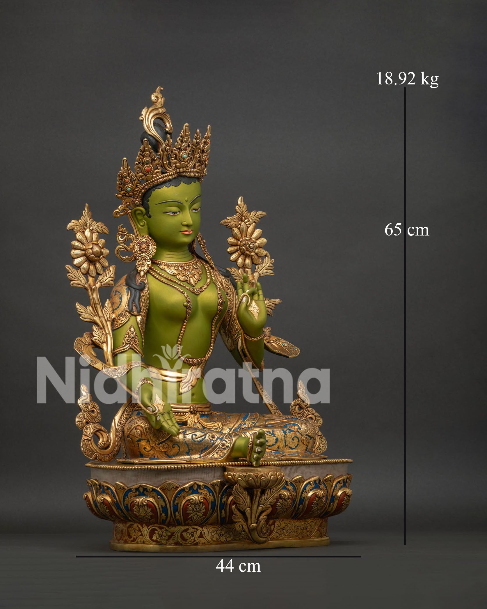 Right side view of Green Tara statue showing lotus flowers jewelry and detailed craftsmanship