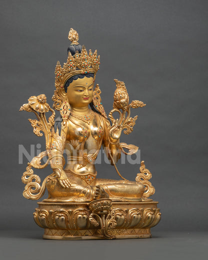 Right side view of Green Tara statue with extended leg resting on lotus, Nepal copper