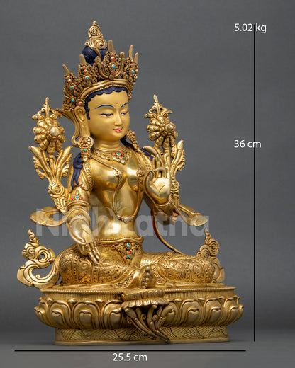 right side view of green tara statue with utpala flower and lotus pedestal details