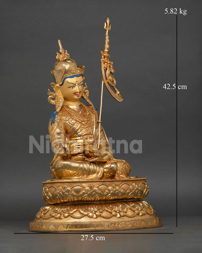 Right-side view of Guru Rinpoche statue with khatvanga trident and gold-gilded copper body