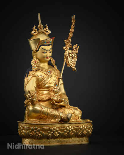 Right side view of Guru Rinpoche statue with vajra and lotus pedestal in 24K gold fire-gilded copper