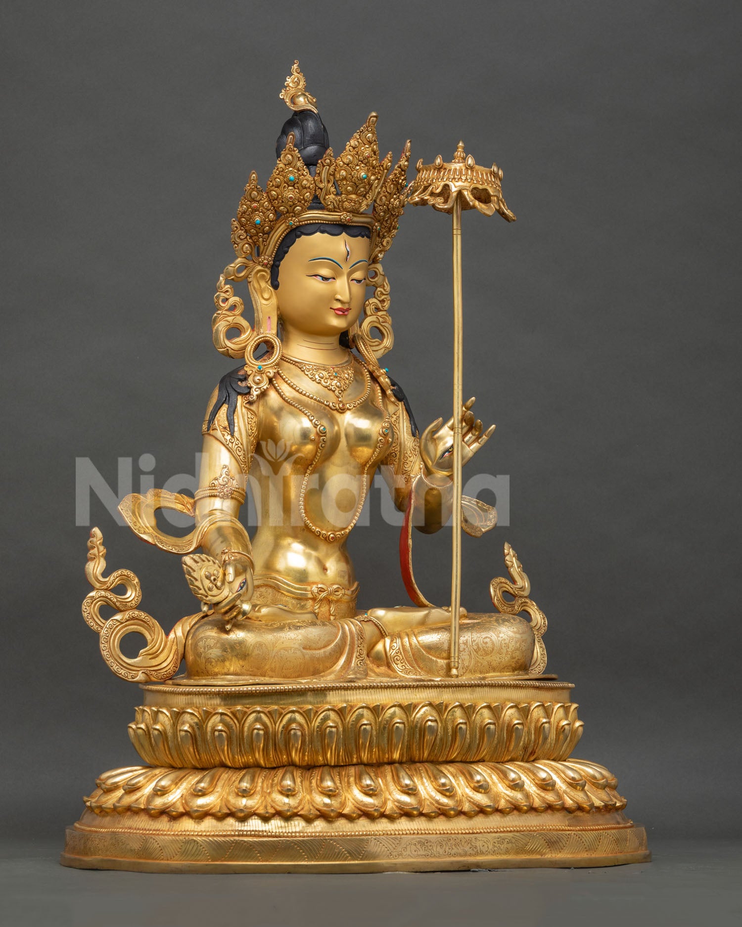 Right side view of handcrafted Dukar Sitatapatra gold statue, Nepal