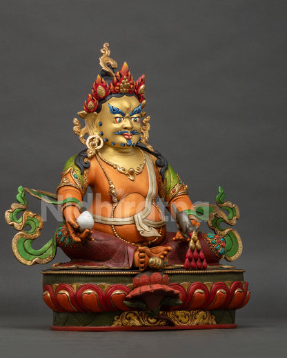 Right side view of handcrafted Dzambhala statue with intricate Buddhist iconography and gold gilded copper