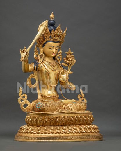 Right side view of handcrafted Manjushri statue with flaming sword, Nepal