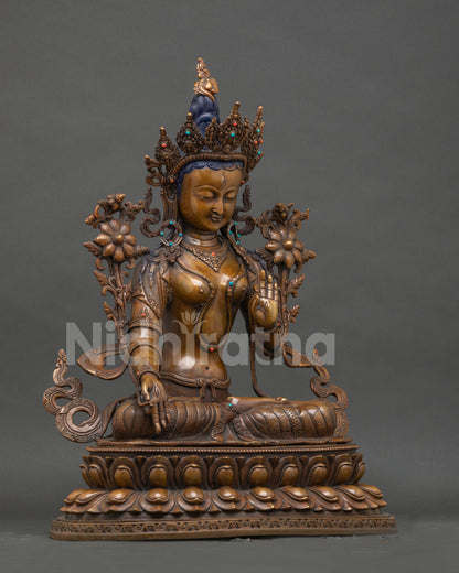 Right side view of handcrafted oxidized copper White Tara Buddhist statue