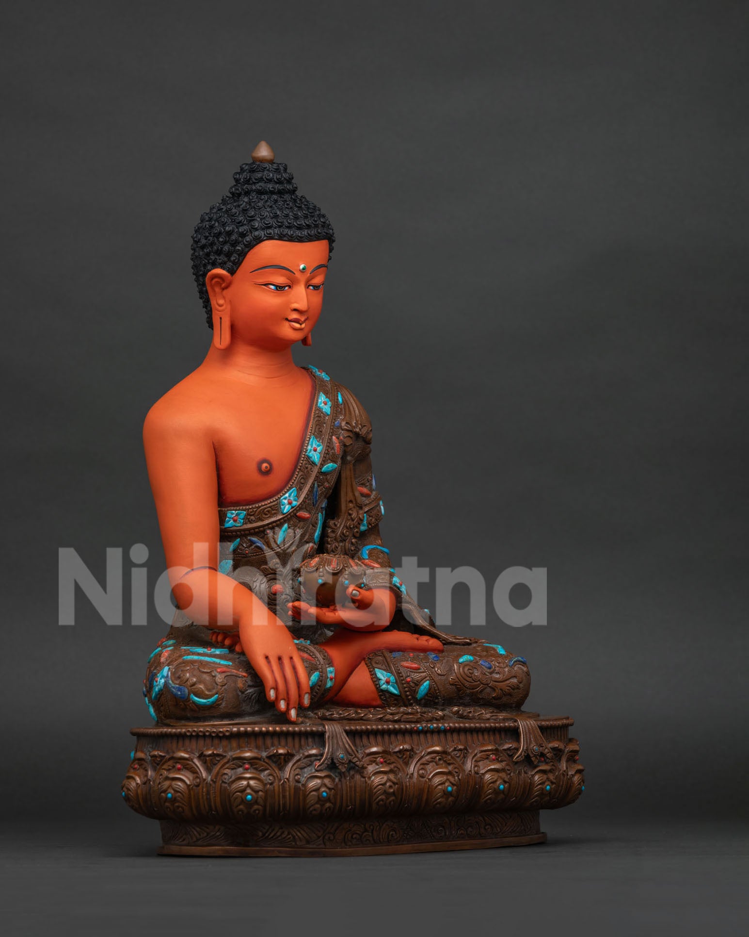 Right side view of handcrafted Shakyamuni Buddha statue seated in meditation on lotus base