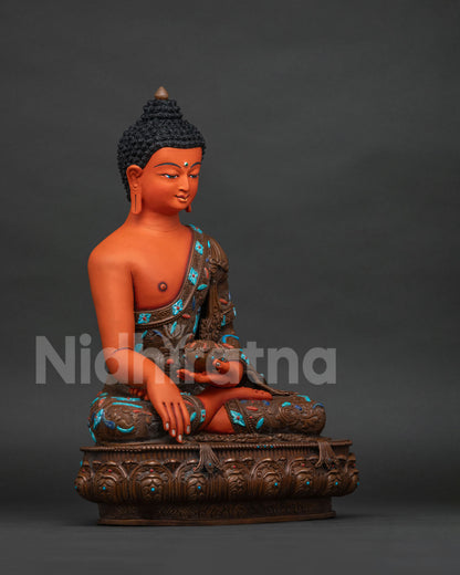 Right side view of handcrafted Shakyamuni Buddha statue seated in meditation on lotus base