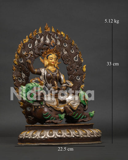 Right side view of handcrafted Tsheringma statue on snow lion throne.