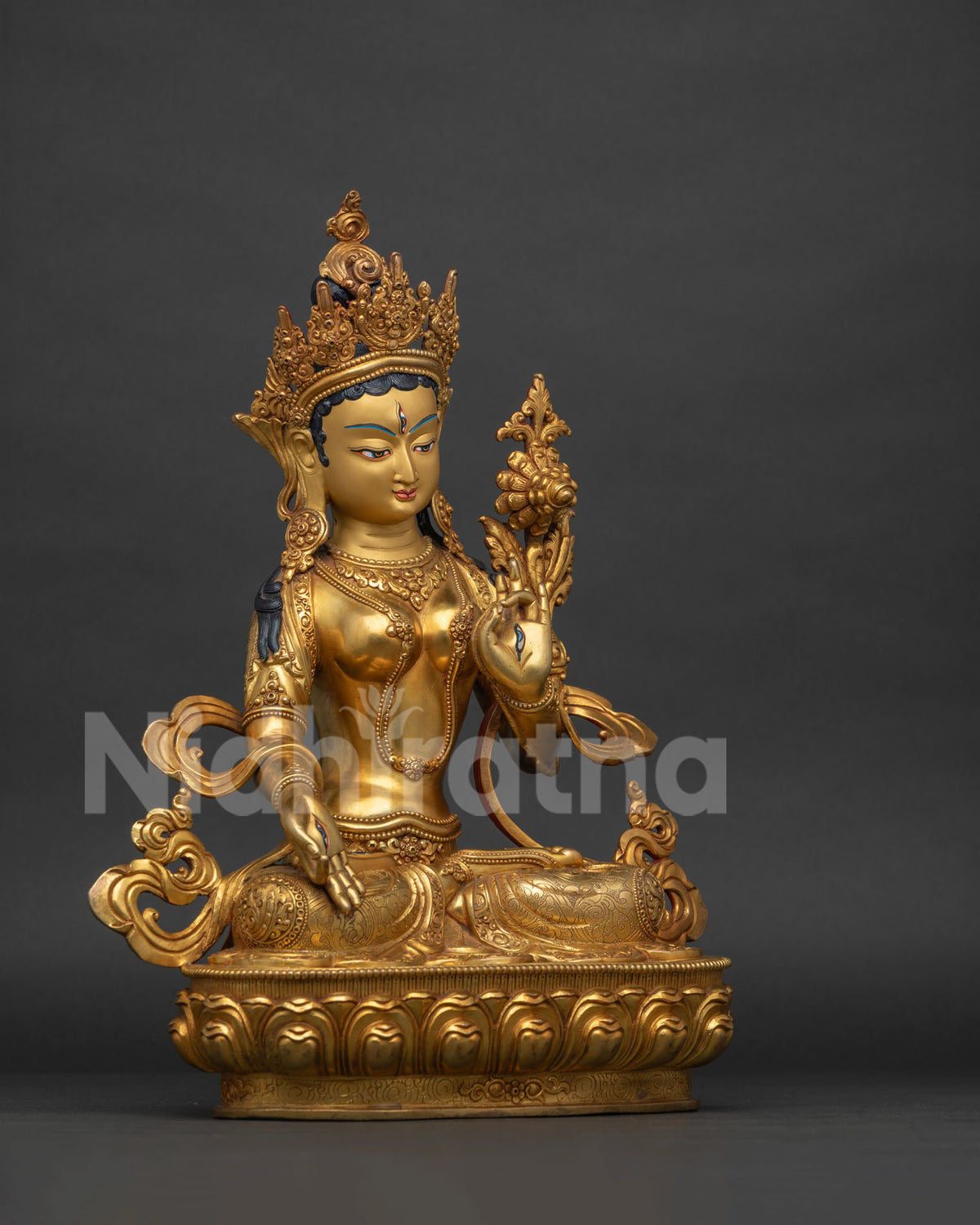 Right side view of handcrafted White Tara statue seated on lotus throne