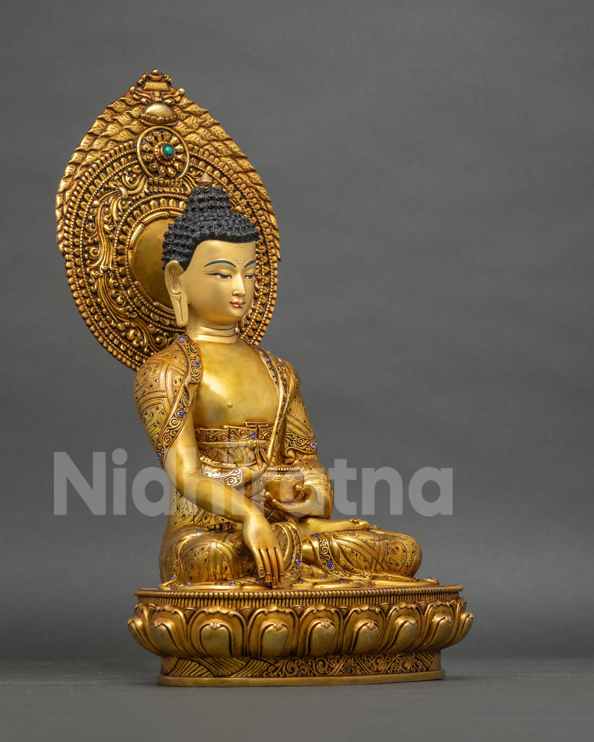 Right side view of handmade Shakyamuni Buddha statue on a double-lotus base with 24K gold finish