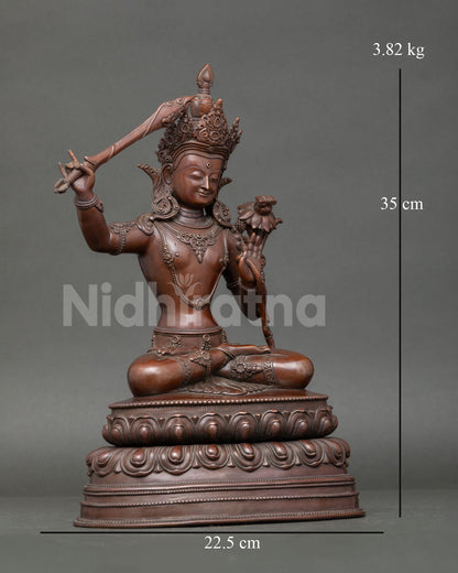 Right-side view of Manjushri copper statue with raised right hand wielding flaming sword of wisdom, Nepalese Buddhist sculpture