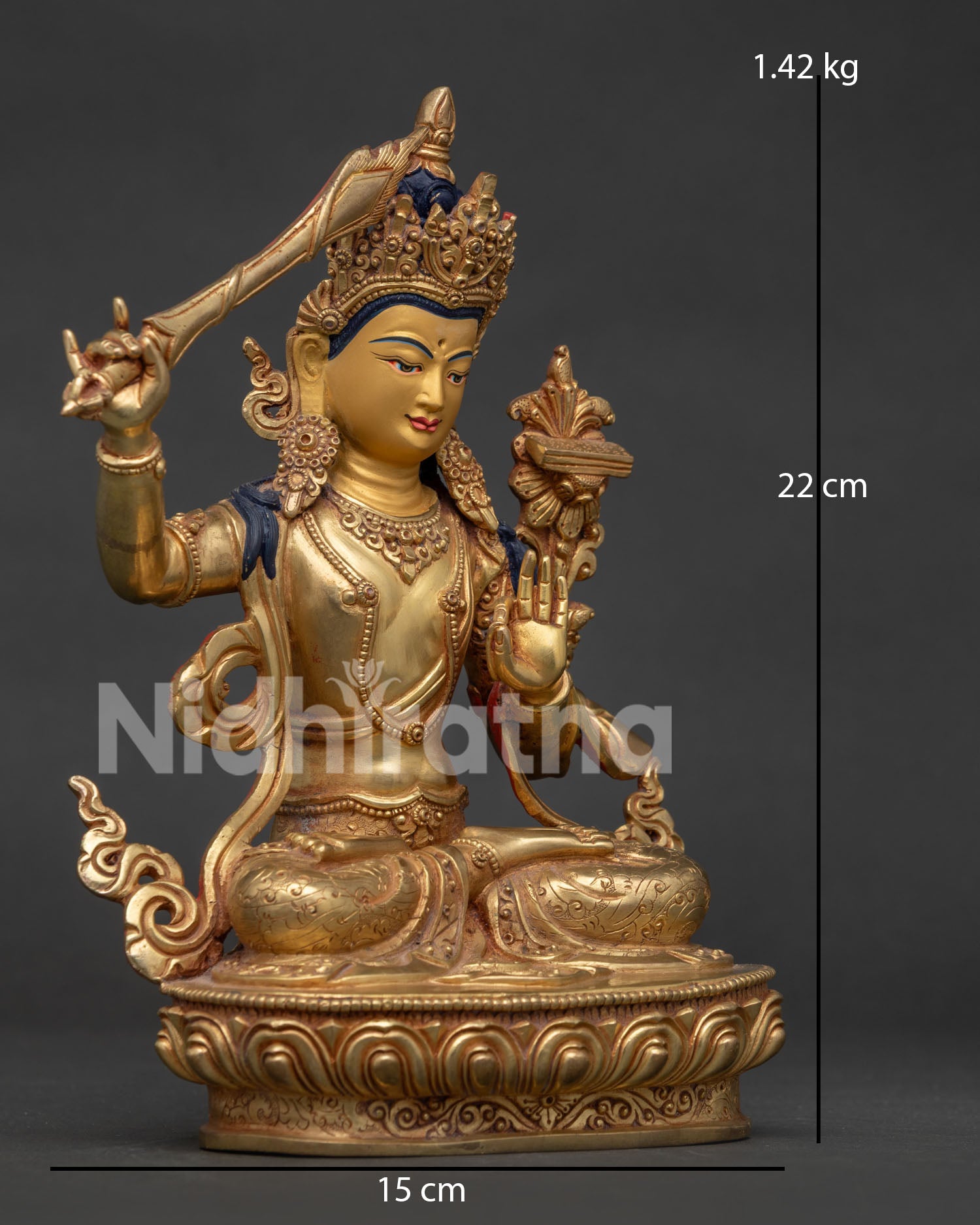 Right side view of Manjushri Statue holding the flaming sword of wisdom