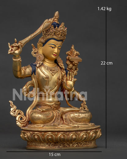 Right side view of Manjushri Statue holding the flaming sword of wisdom