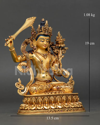 Right side view of Manjushri statue holding wisdom sword and flower