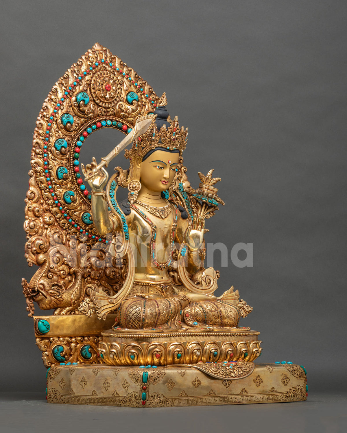 Right side view of Manjushri statue seated on a lotus throne with wisdom sword and floral halo
