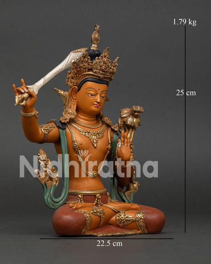 Right side view of Manjushri Statue with flaming sword raised, lotus seat detail