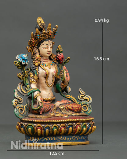 right side view of mini white tara statue for desk altar and travel meditation