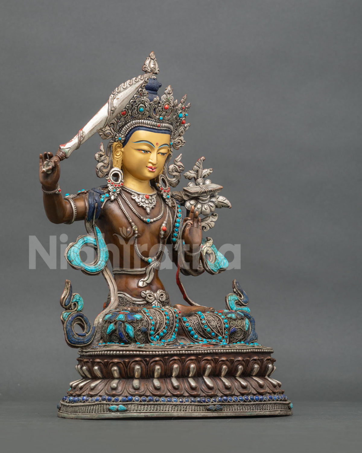 Right Side View of Oxidized Copper Manjushri Statue on Lotus Throne