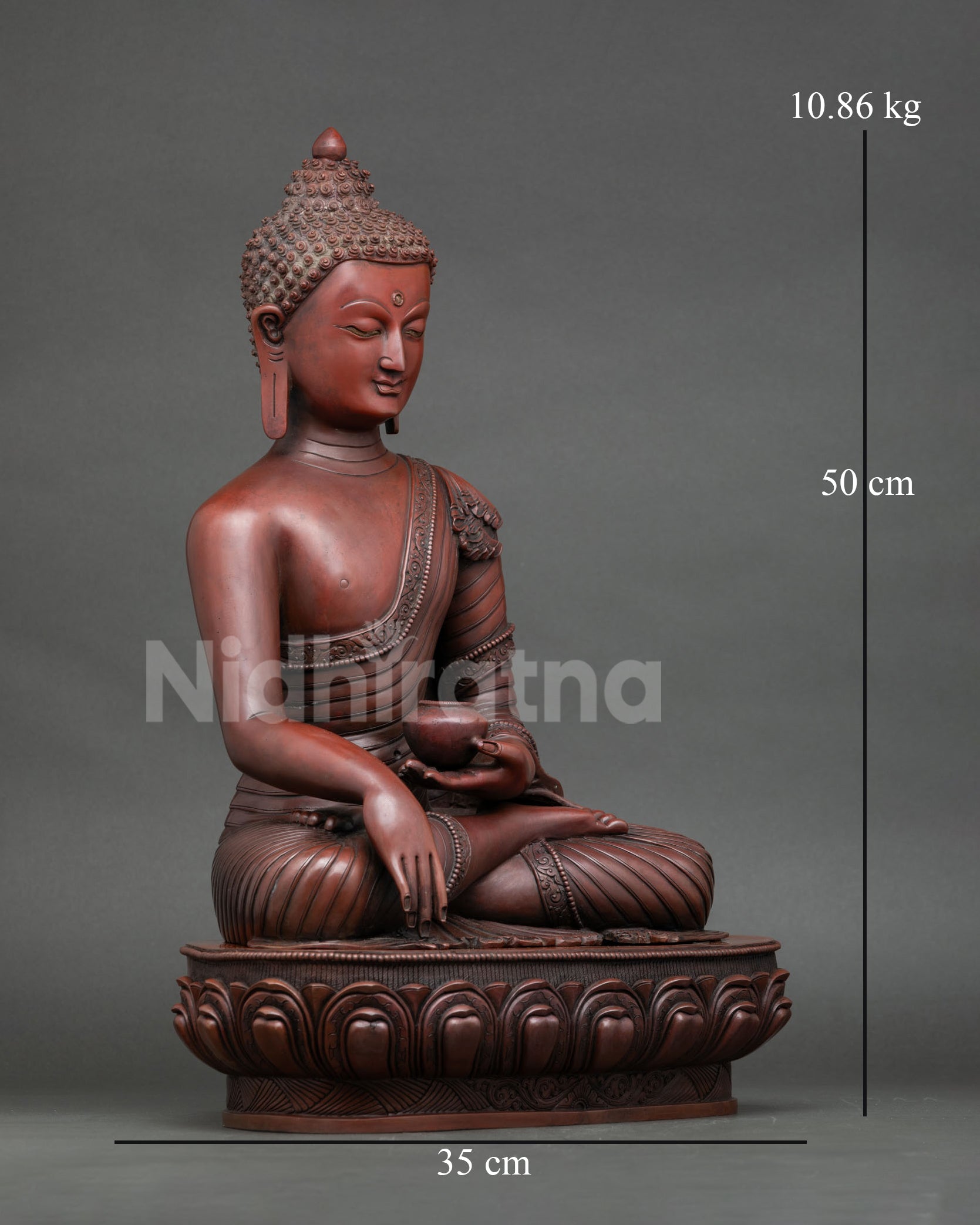 Right side view of oxidized copper Shakyamuni Buddha statue seated on lotus throne