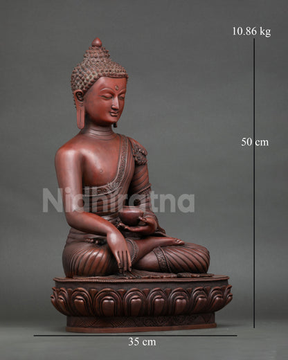Right side view of oxidized copper Shakyamuni Buddha statue seated on lotus throne