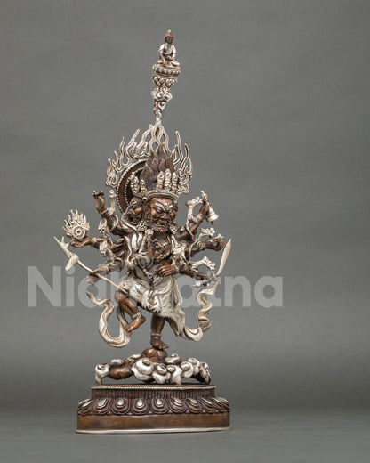 Right side view of oxidized copper Ucchusma statue with silver-plated tiger-skin garment and flaming halo