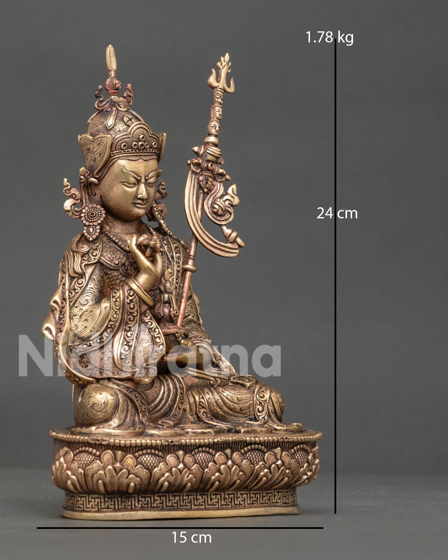 Right side view of pure copper Guru Tsokye Dorje statue with khatvanga staff