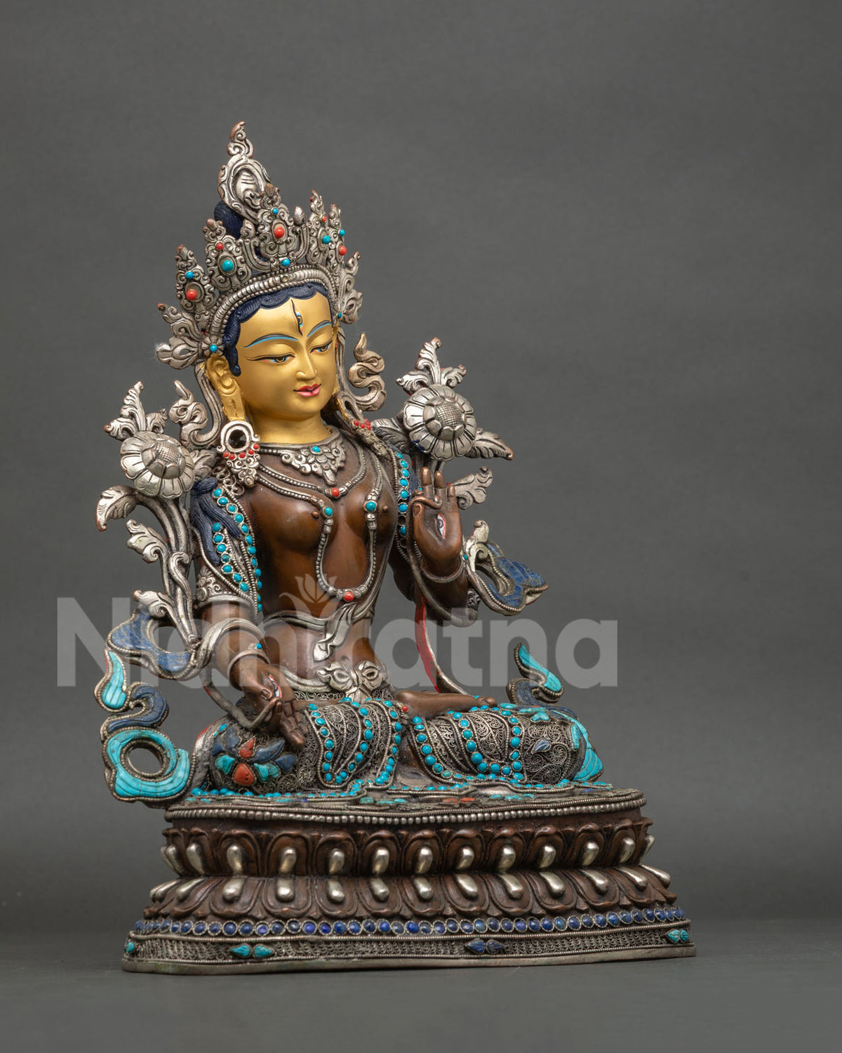 Right side view of Seven-Eyed White Tara statue, handcrafted copper figurine on lotus pedestal