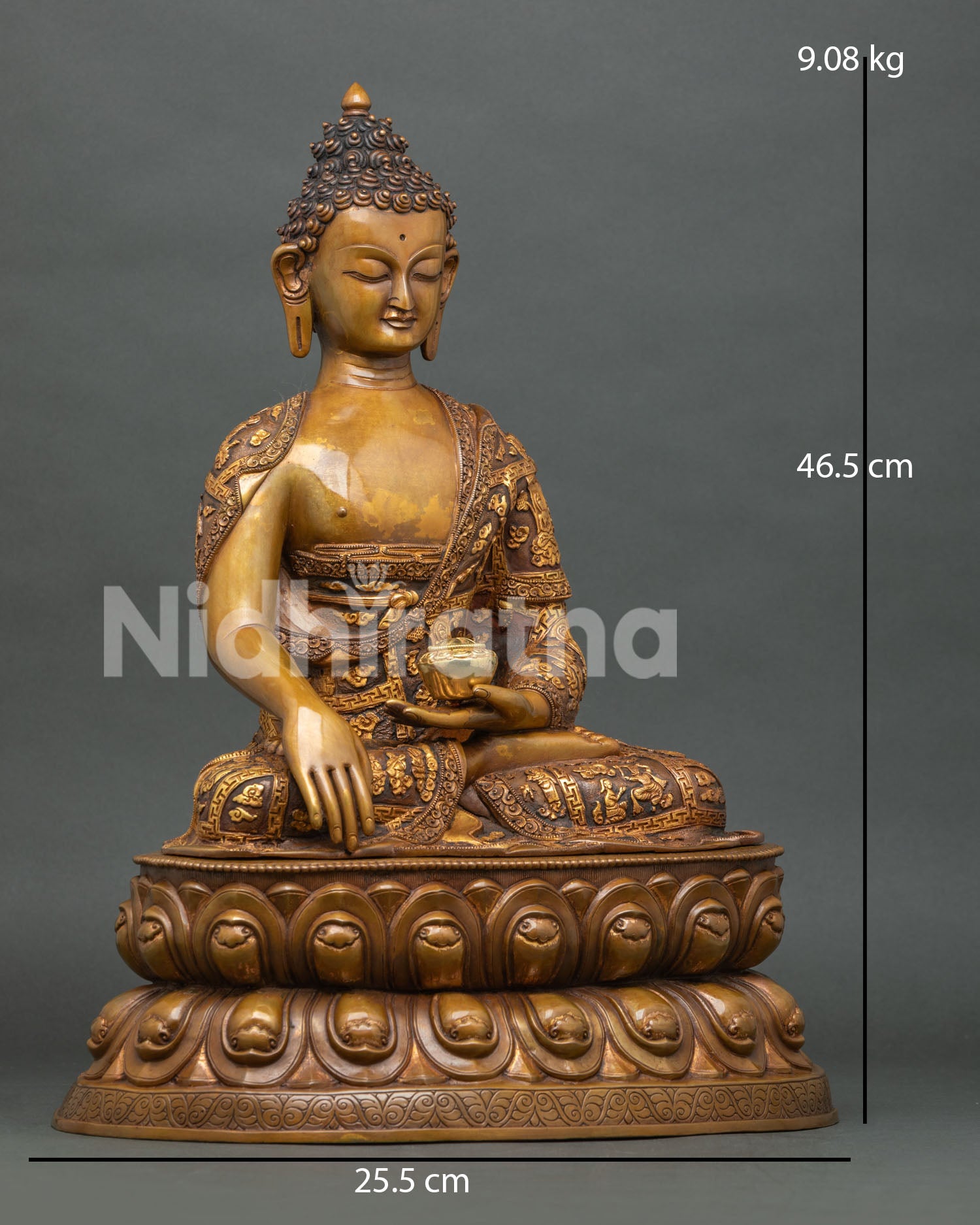 Right side view of Shakyamuni Buddha statue holding gilded patra bowl with detailed narrative robe carvings
