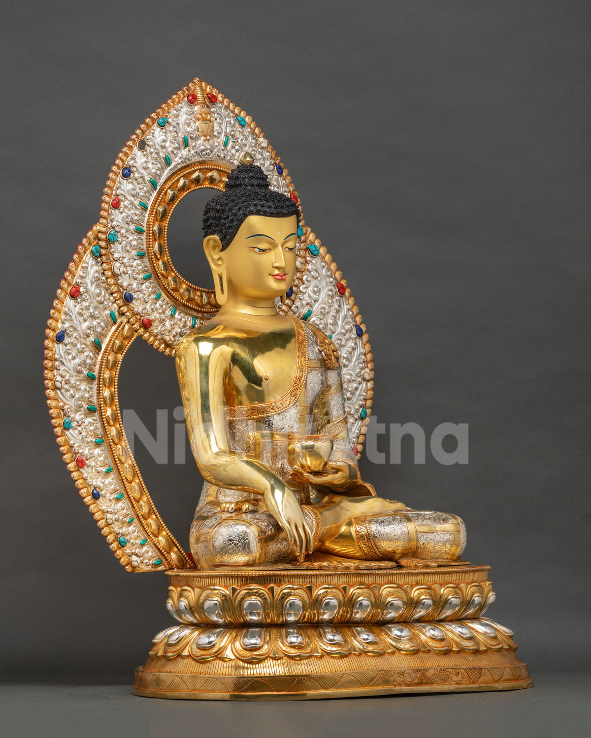 Right side view of Shakyamuni Buddha statue with jeweled halo and layered lotus pedestal, Nepal