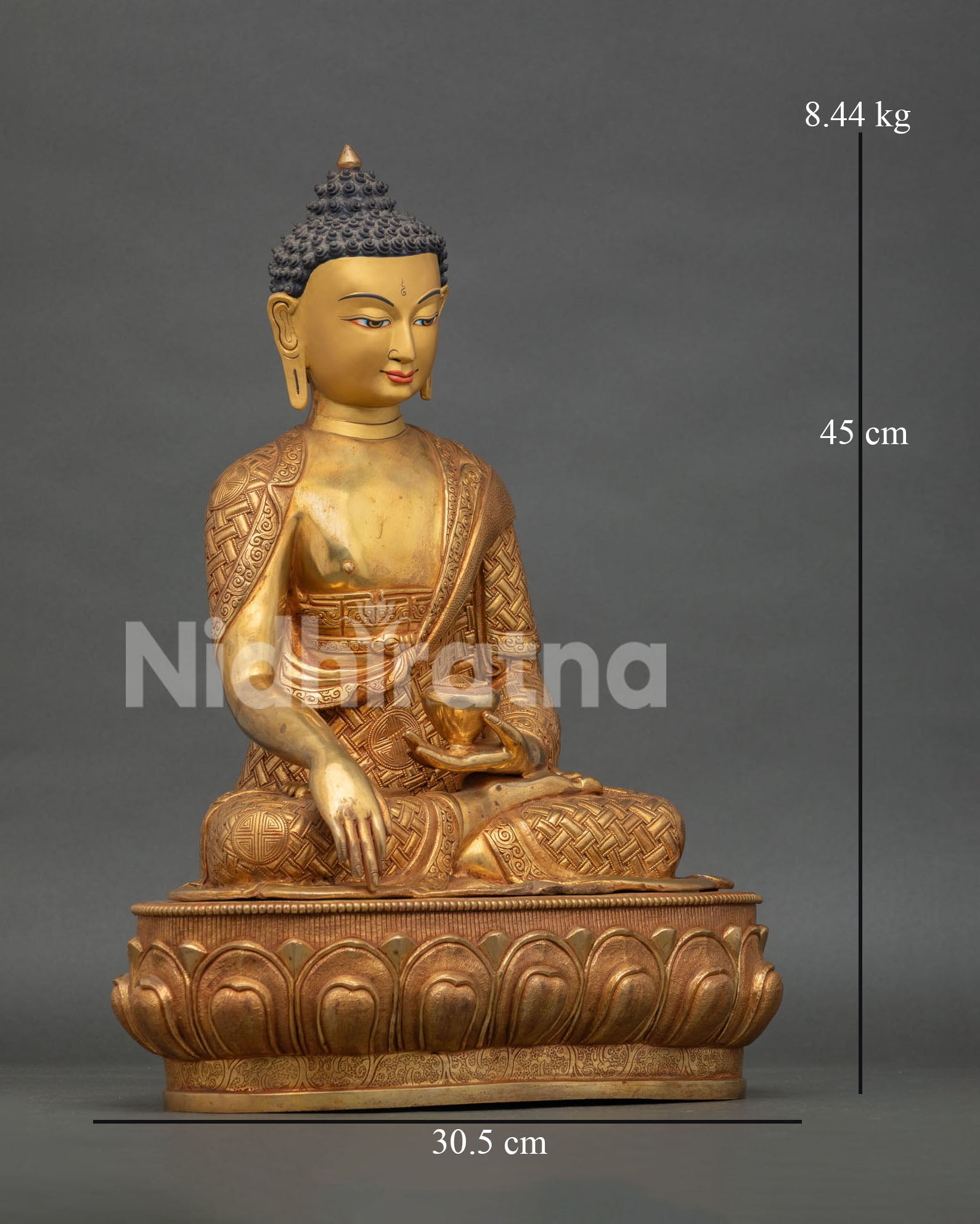 right side view of shakyamuni buddha statue with lotus pedestal and gold gilding