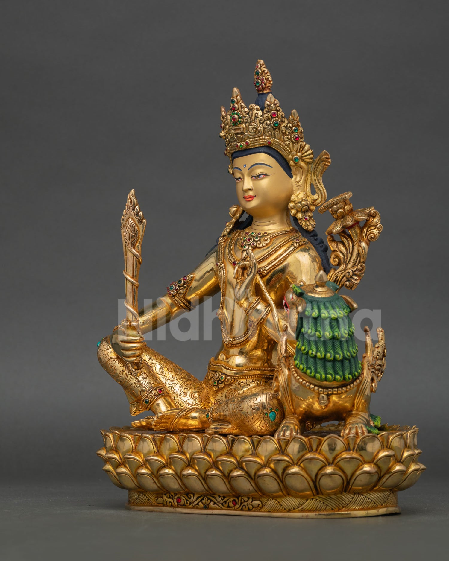 Right side view of Simhanada Manjushree sculpture showing detailed copper craftsmanship gold gilded finish and sacred ornaments with semi precious stone decoration.