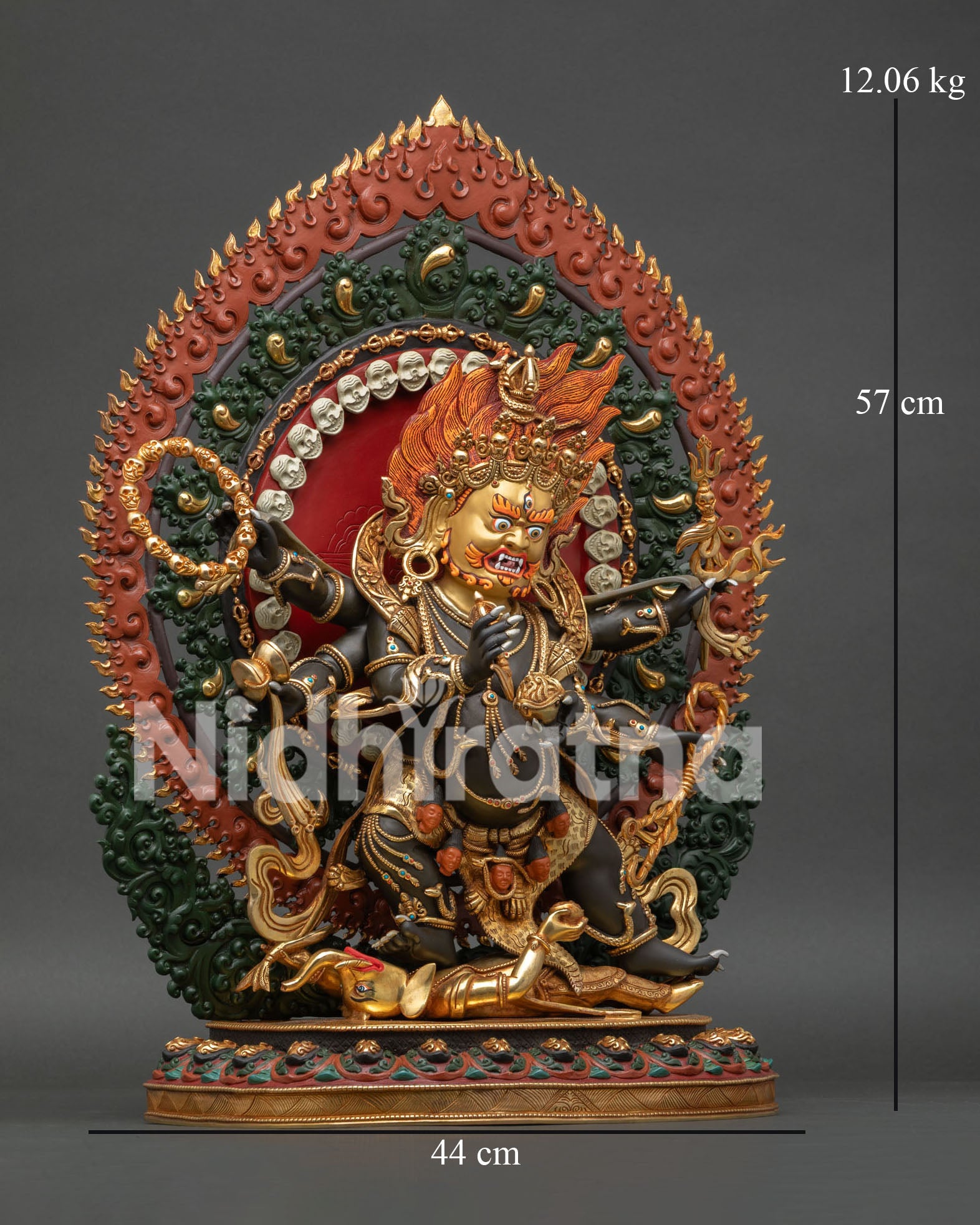 Right Side View of Six Armed Mahakala Statue with Flaming Halo and Sacred Implements