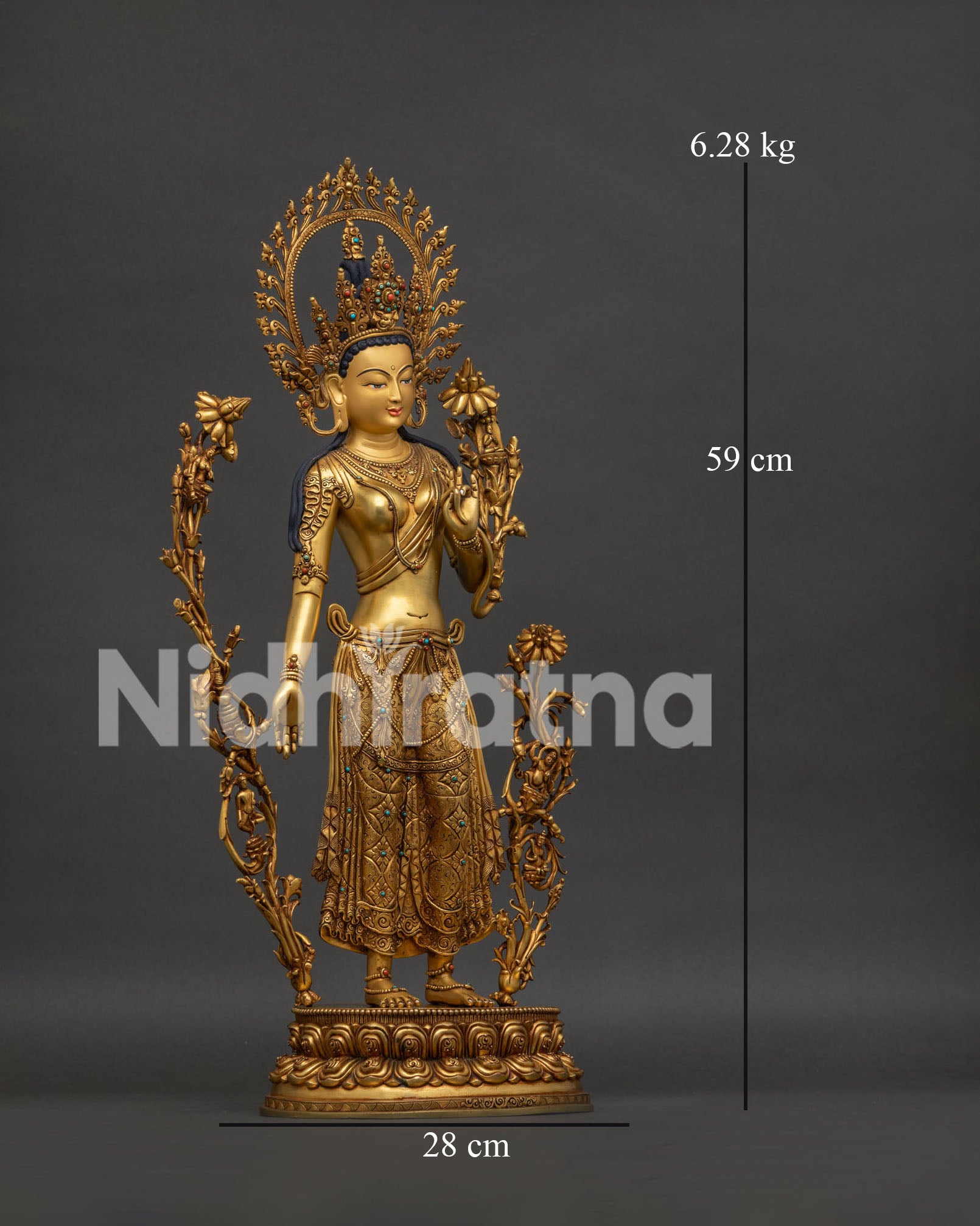 right side view of standing green tara with ornate jewelry and flowing lotus stems