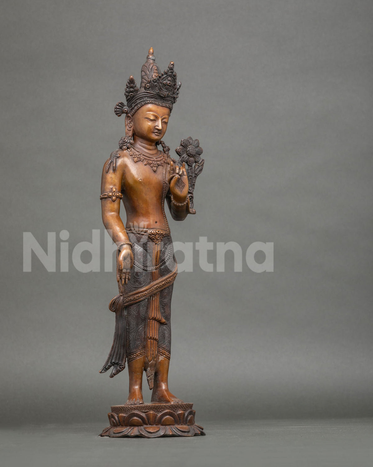 Right side view of standing Lokeshwor statue with lowered hand in generosity gesture, Nepal