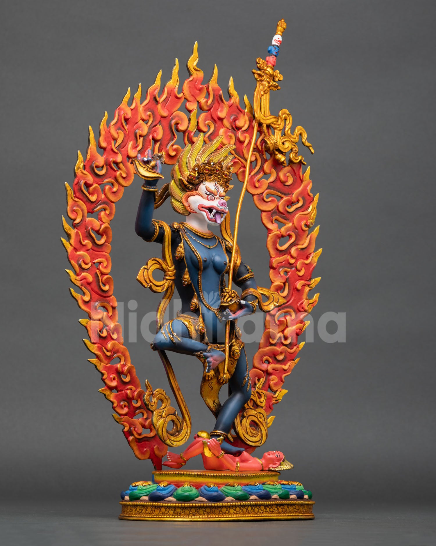 right side view of standing simhamukha statue with flaming aureole and lotus base