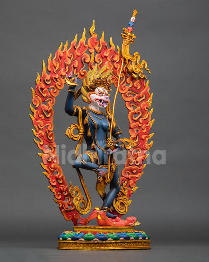right side view of standing simhamukha statue with flaming aureole and lotus base