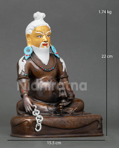 Right-side view of Thangtong Gyalpo oxidized copper statue holding chain and vase