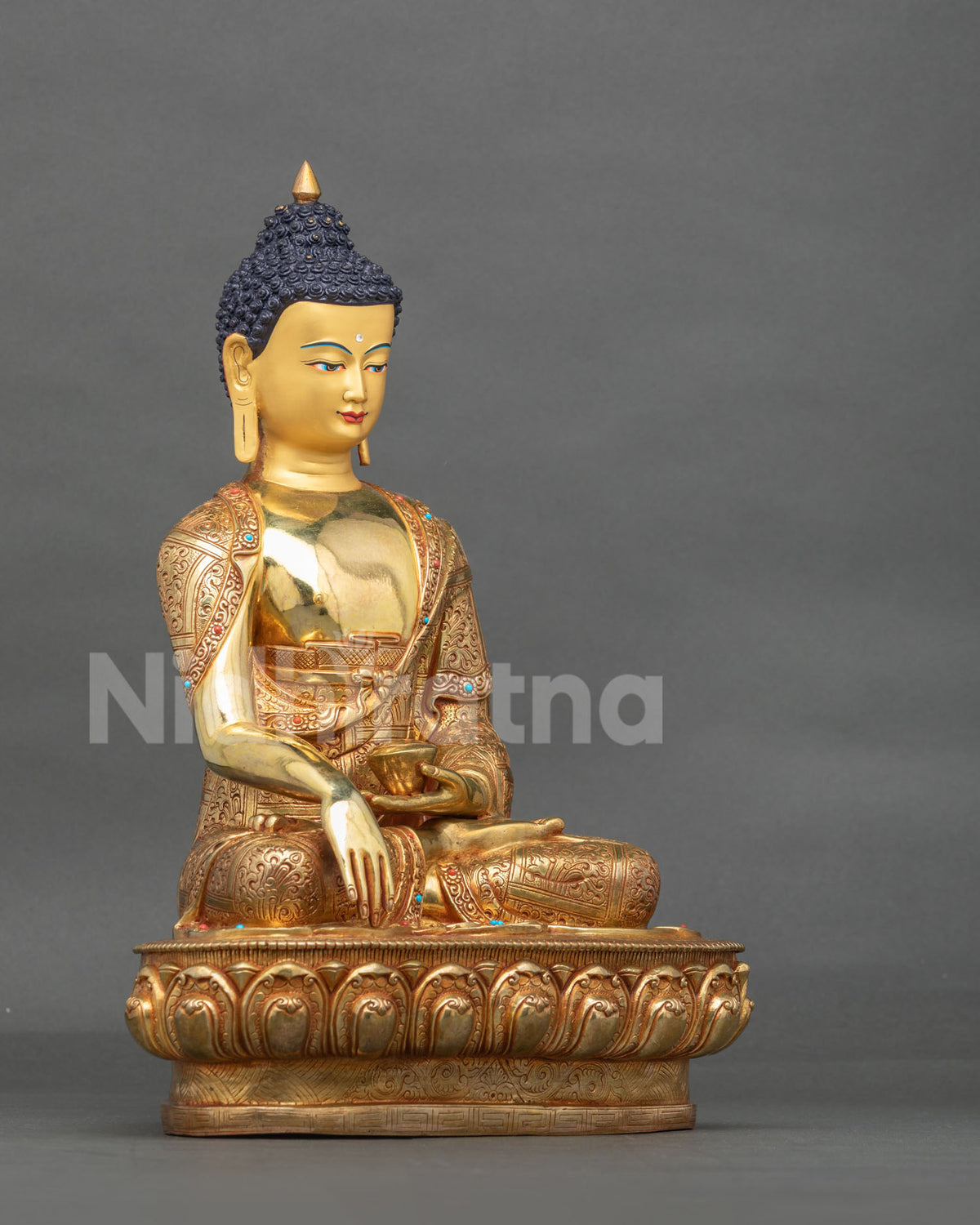 Right side view of Tibetan Buddhist Shakyamuni statue showing flowing monastic robe details.