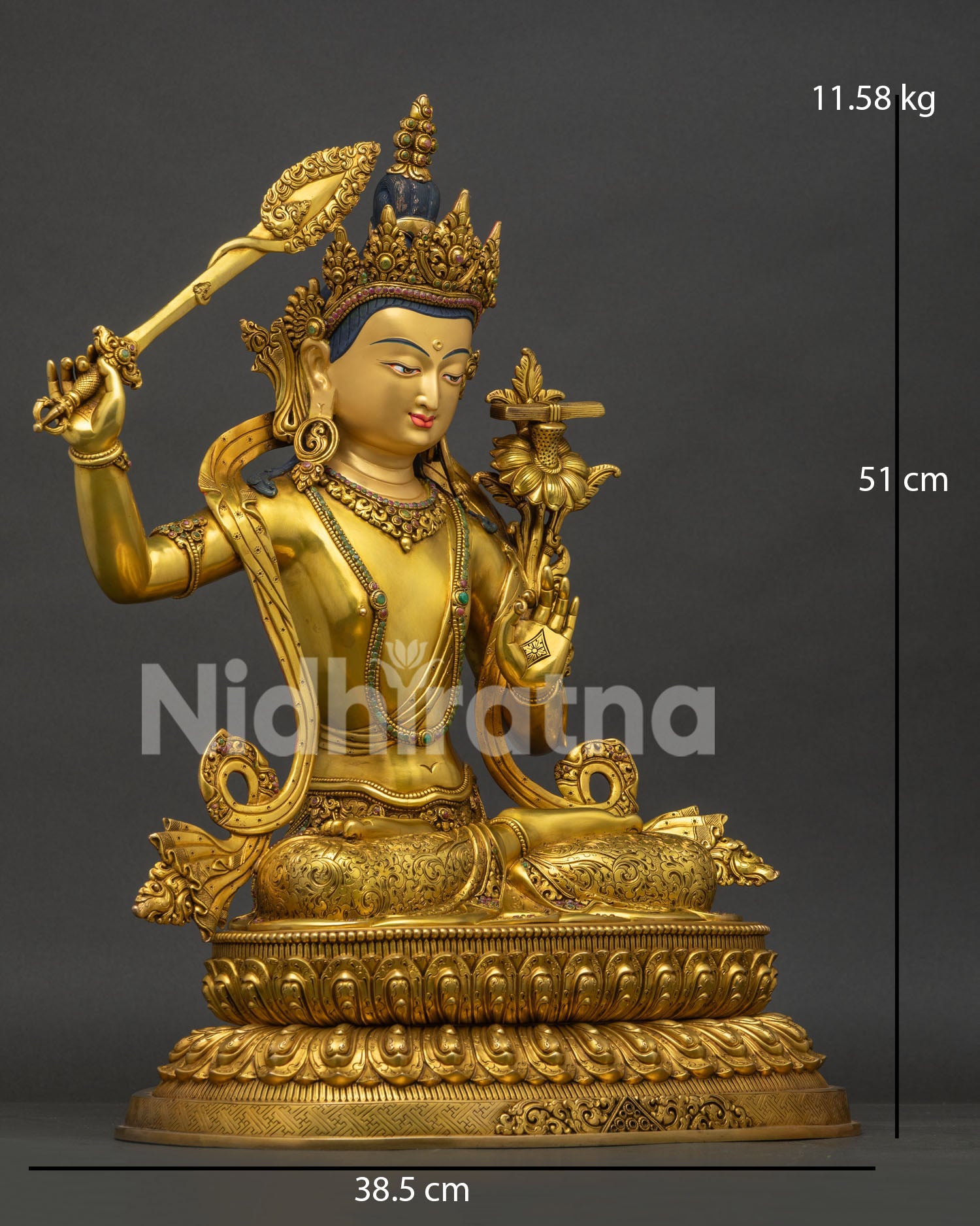 Right side view of Tibetan Manjushri statue holding flaming sword