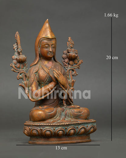 right side view of tsongkhapa statue with traditional gelug pandit hat