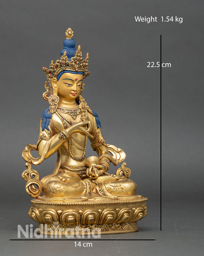 Right side view of Vajrasattva copper statue seated in vajra posture with ritual bell