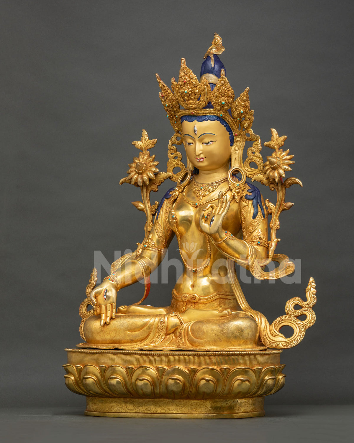 Right side view of White Tara statue, gold-gilded copper Buddhist sculpture