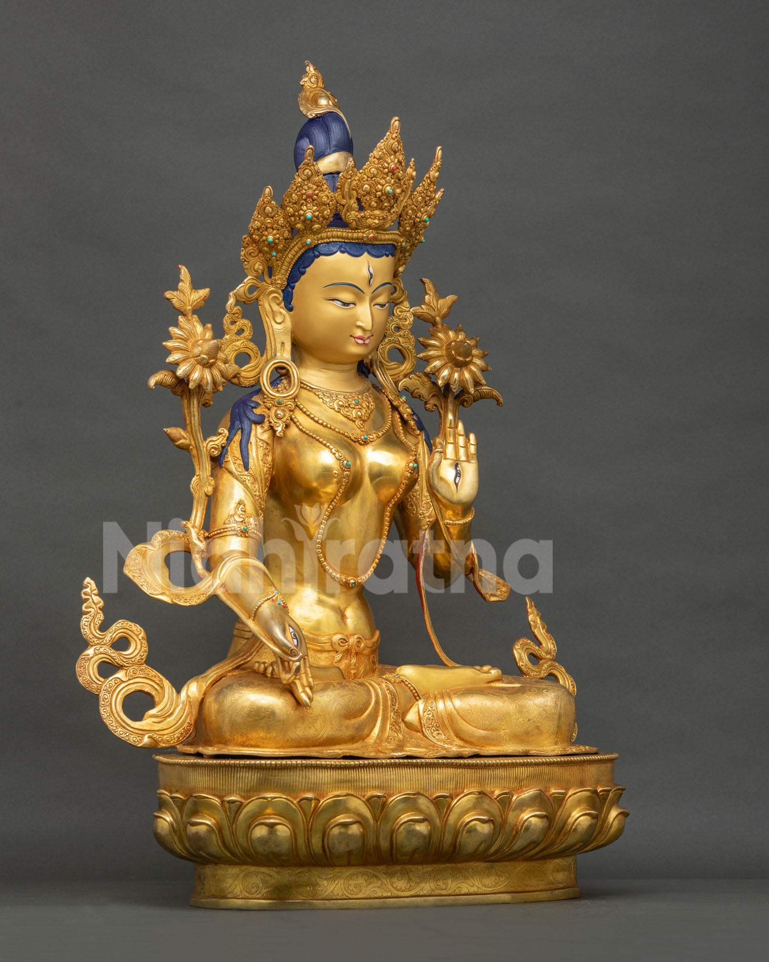 Right side view of White Tara statue, gold-gilded copper Buddhist sculpture