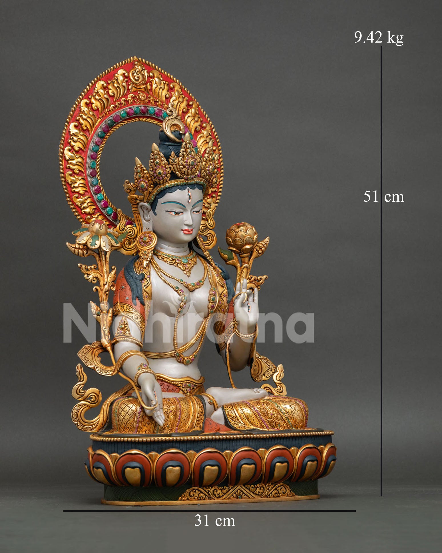 right side view of white tara statue, traditional nepali buddhist artwork