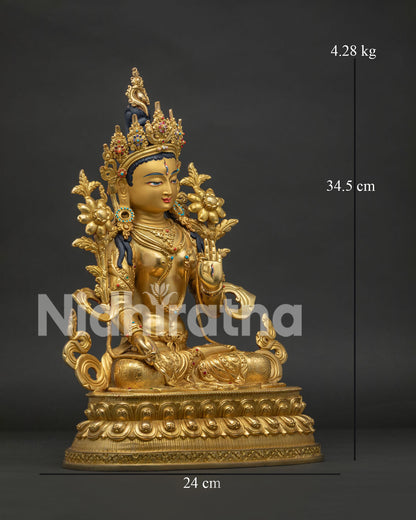 Right side view of White Tara Statue with lotus pedestal and sacred ornaments