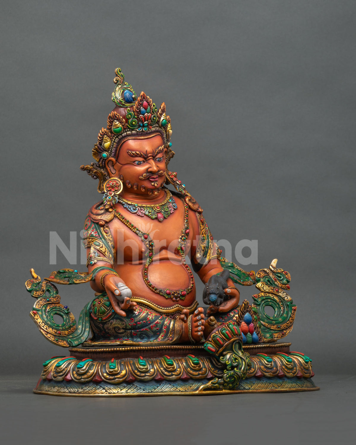 Right side view of Yellow Dzambhala copper statue holding a citron with engraved lotus base