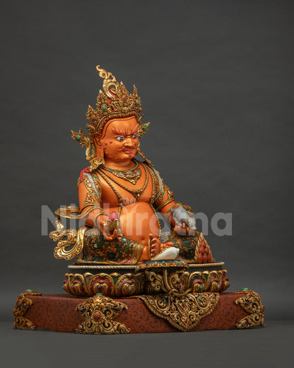 Right side view of Yellow Dzambhala statue showing hand-carved lotus base and robe detailing