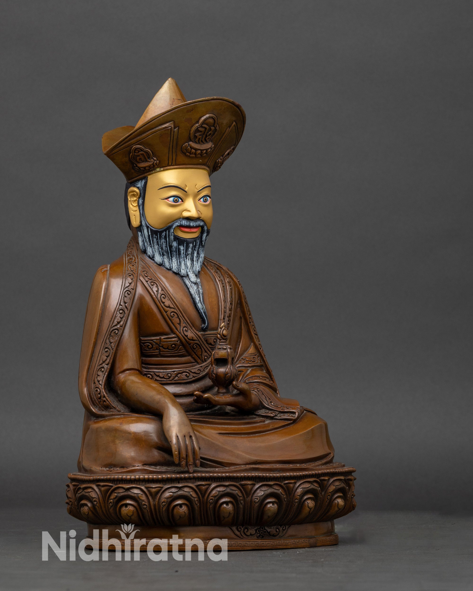 Right side view of zhabdrung rinpoche statue, displaying sacred ritual objects and wrathful expression