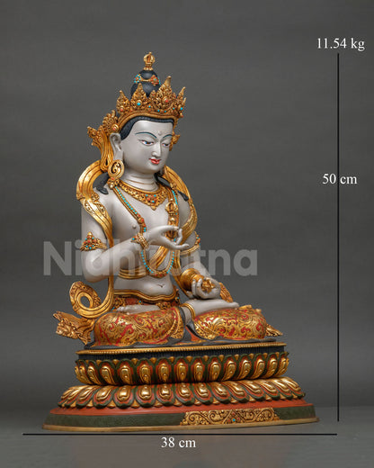 Right side view Vajrasattva statue holding vajra and bell on lotus pedestal