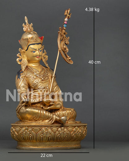 Side face close-up of Guru Padmasambhava Statue with gold-painted features and ornate crown